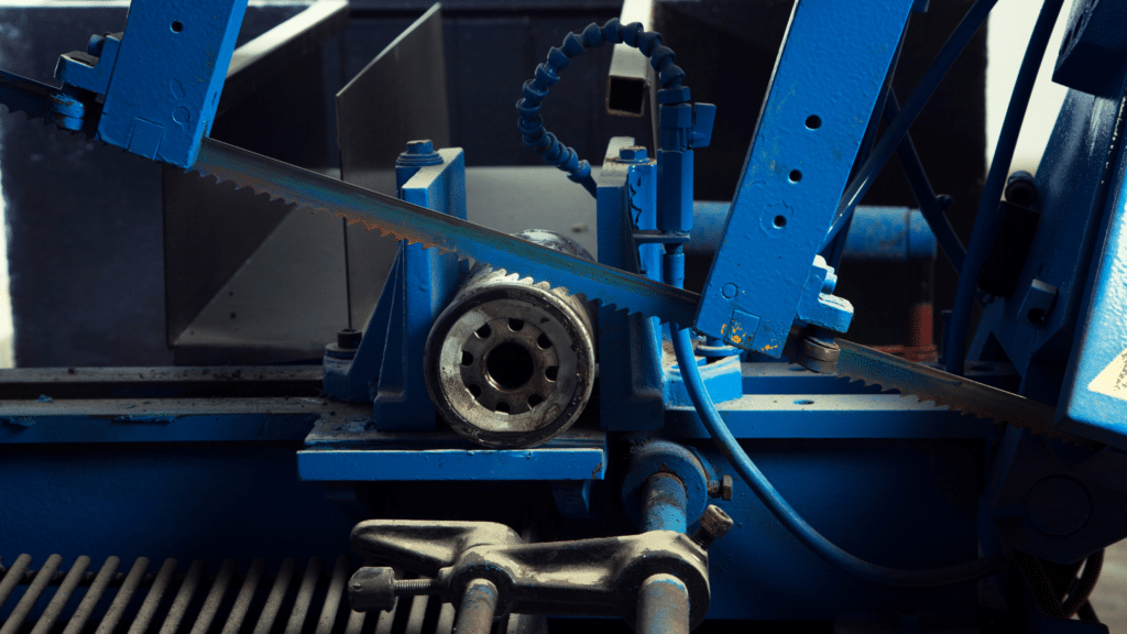 Closeup of a hacksaw cutting metal